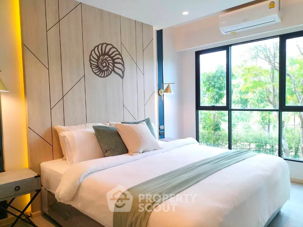 Luxurious bedroom with large windows and stylish decor in modern apartment