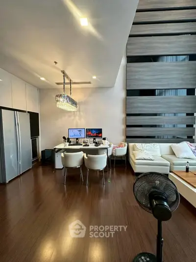 Spacious modern living room with high ceiling and elegant decor
