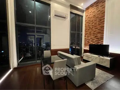 Luxurious high-rise living room with floor-to-ceiling windows and stunning city view.
