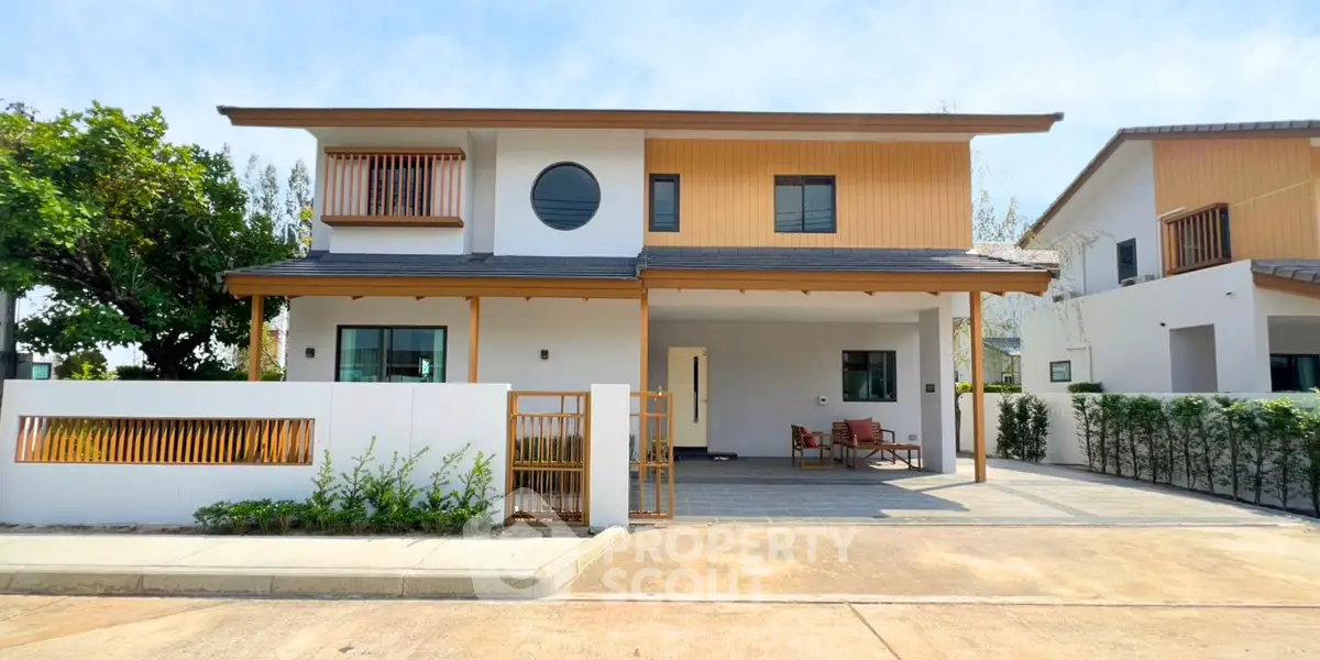 Modern two-story house with spacious driveway and stylish wooden accents