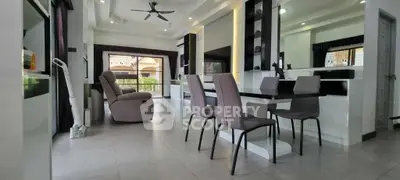 Spacious modern living room with dining area and large windows