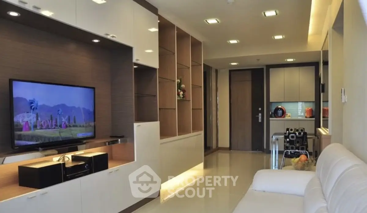Modern living room with sleek furniture and built-in TV unit