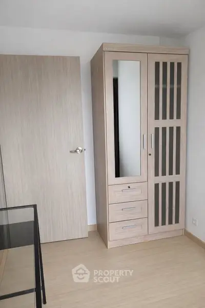 Modern bedroom with sleek wardrobe and minimalist design