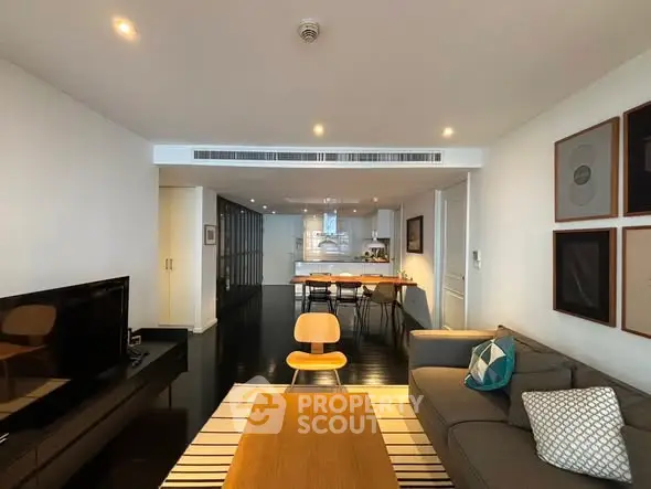 Spacious modern living room with open kitchen and stylish decor