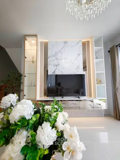 Luxurious living room with elegant marble feature wall and modern decor