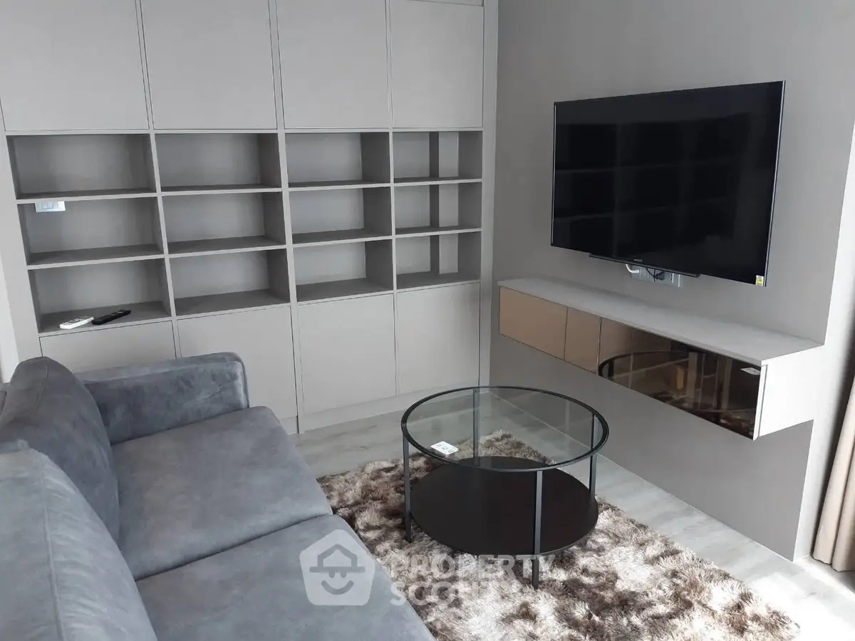 Modern living room with sleek shelving and wall-mounted TV