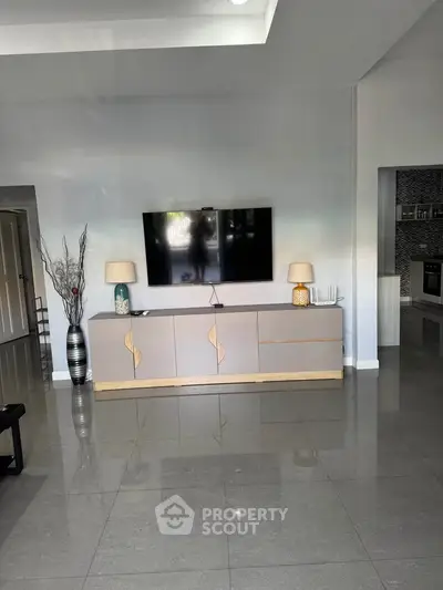 Modern living room with sleek TV setup and stylish decor