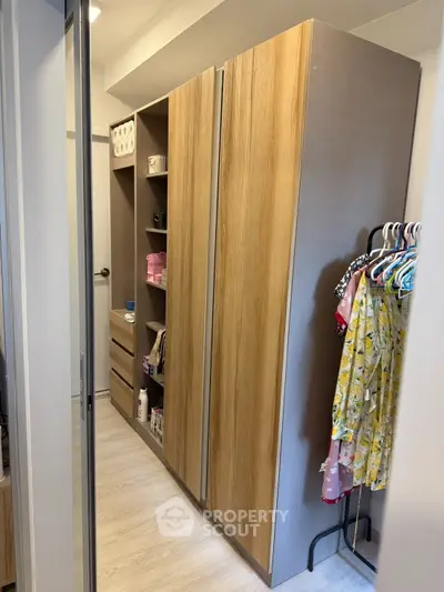 Spacious walk-in closet with wooden cabinets and ample storage space