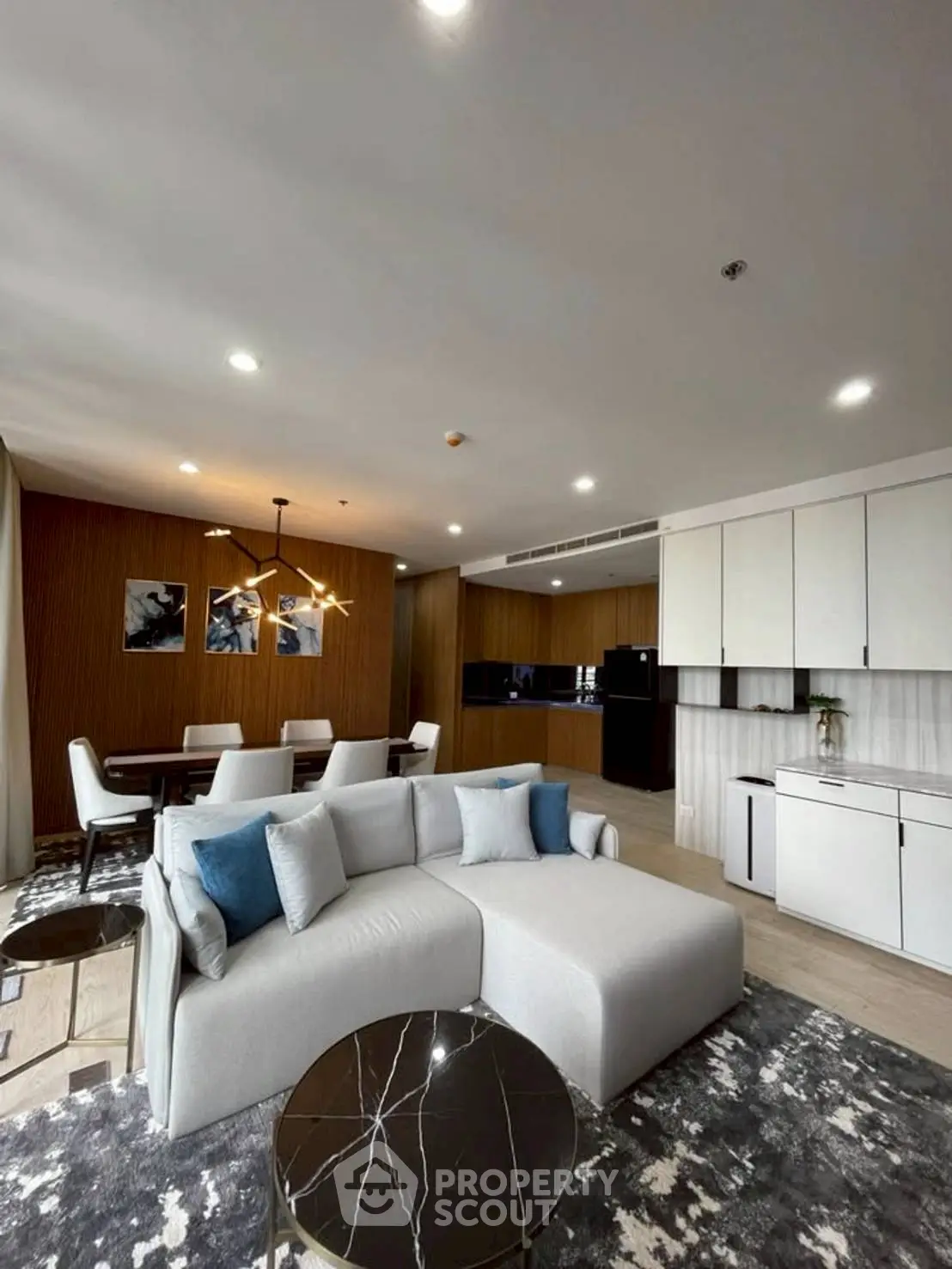 Modern open-plan living room with stylish decor and dining area