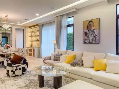 Luxurious living room with elegant decor, plush seating, and modern art, perfect for sophisticated living.