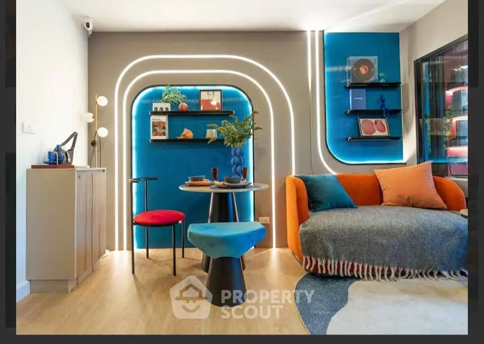 Modern living room with vibrant decor and unique lighting design