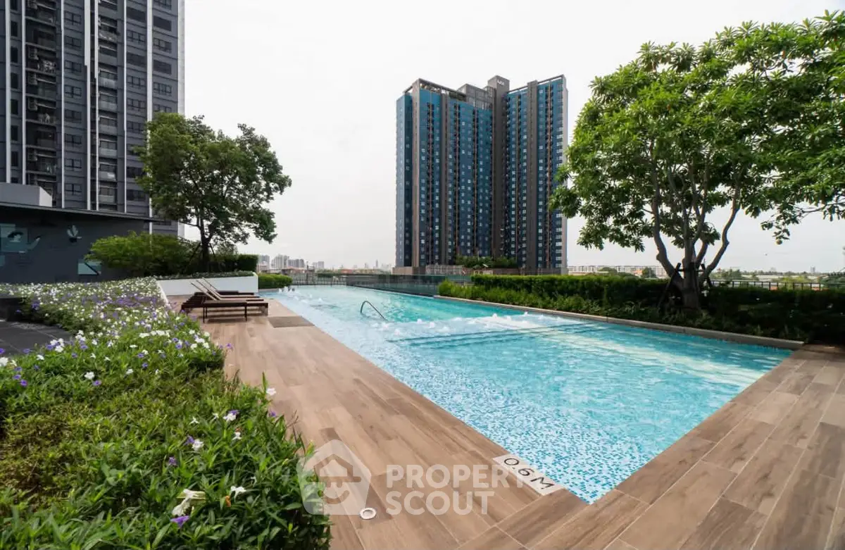Luxurious rooftop pool with stunning city views and lush greenery