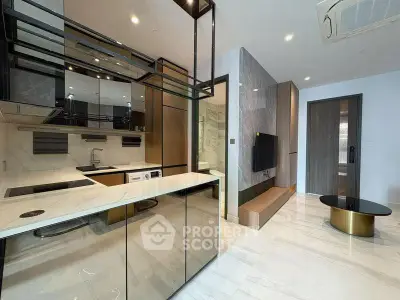 Modern open-layout kitchen with sleek design and integrated appliances in luxury apartment.