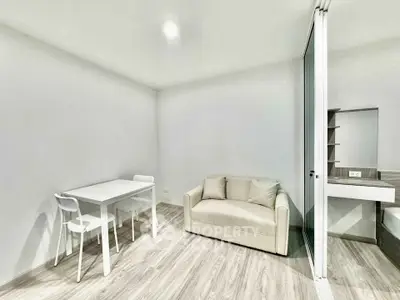 Modern minimalist living room with sleek furniture and neutral tones