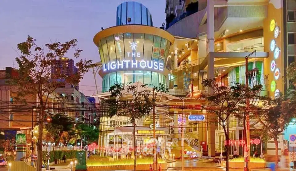 Stunning modern commercial building with vibrant lighting and unique architectural design.