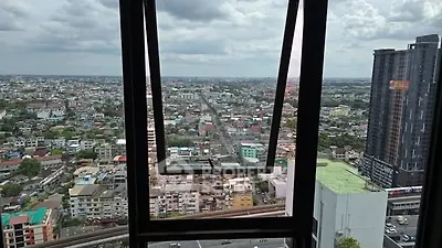 Stunning cityscape view from high-rise building window with expansive skyline.