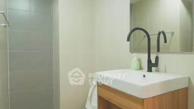 Modern bathroom with sleek sink and stylish faucet