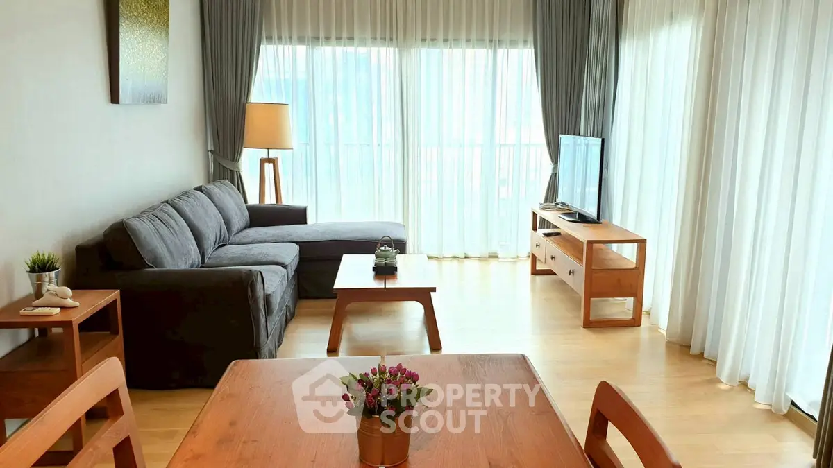 Spacious living room with modern furniture and natural light
