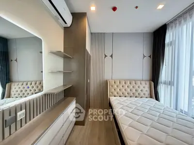 Modern bedroom with stylish decor and large window for natural light