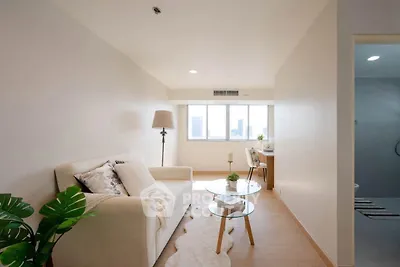 Bright and cozy living room with modern decor and city view.