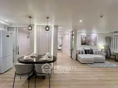 Luxurious open-plan living room with elegant dining area and modern decor