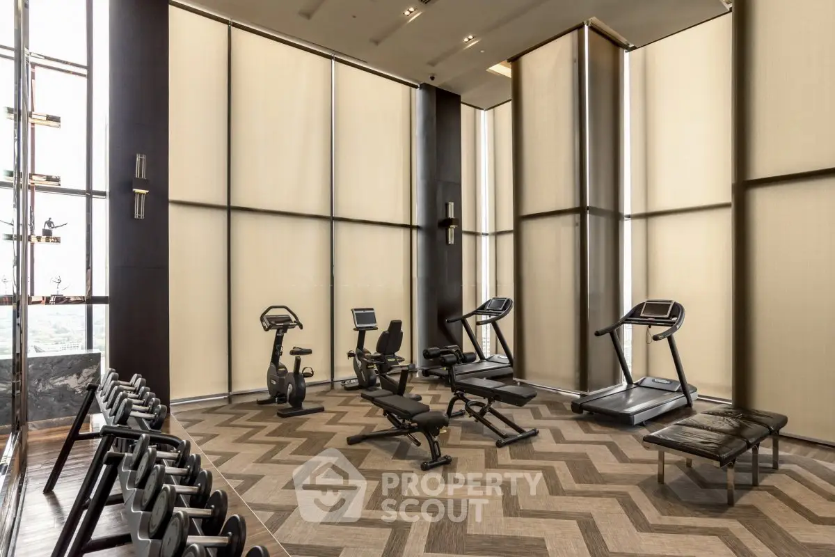 Luxurious high-rise gym with modern equipment and stunning city views.