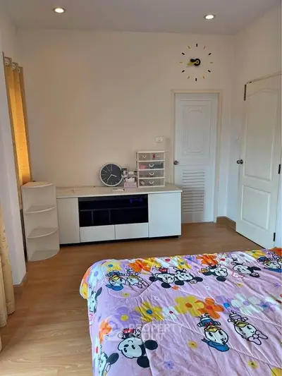 Charming bedroom with playful decor and modern furnishings