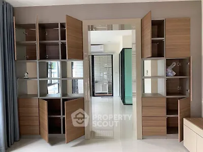 Modern interior with open wooden cabinets and sleek design