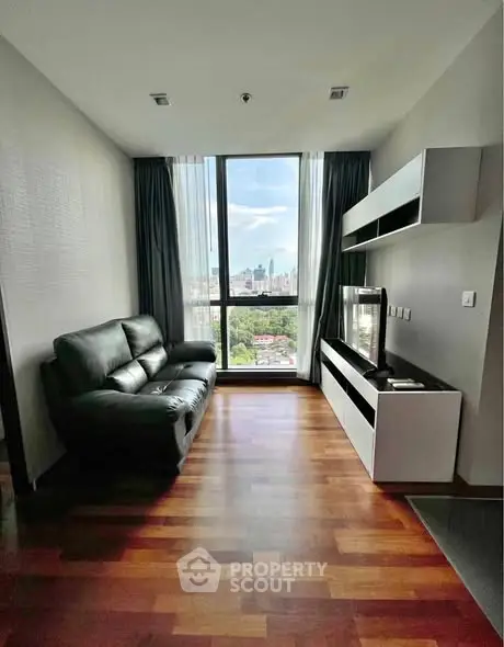 Modern living room with stunning city view and sleek furnishings