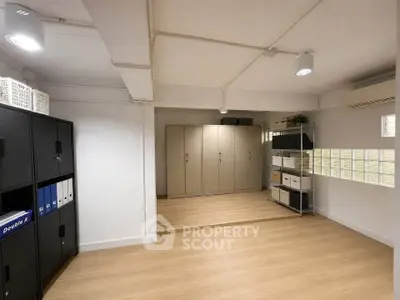 Spacious storage room with modern shelving and ample lighting