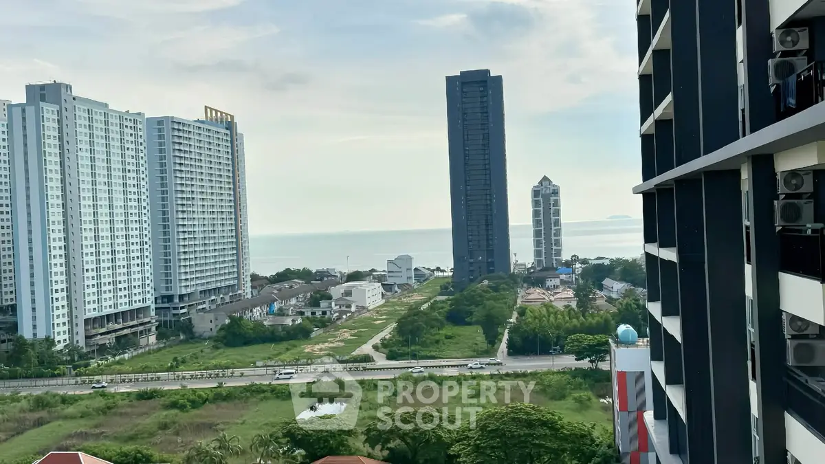 Stunning high-rise buildings with ocean view from a balcony, perfect for urban living.