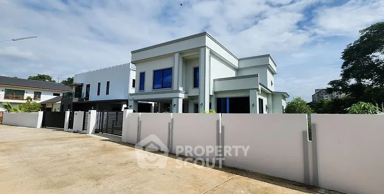 Modern luxury house with sleek design and spacious layout in a serene neighborhood.