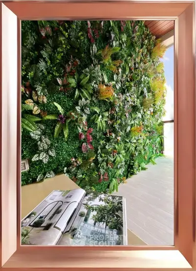 Luxurious vertical garden wall in modern interior space with open magazine on table.