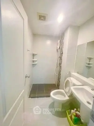 Modern bathroom with sleek fixtures and spacious shower area