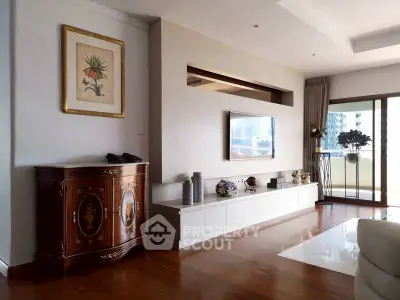 Elegant living room with modern decor and spacious balcony view.