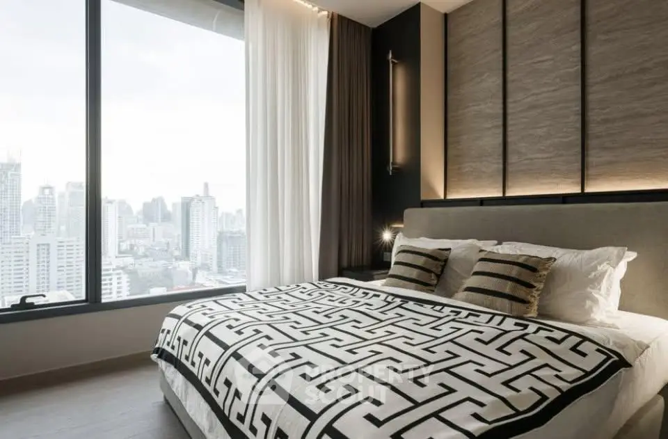 Luxurious bedroom with city view, modern decor, and elegant bedding in high-rise apartment.