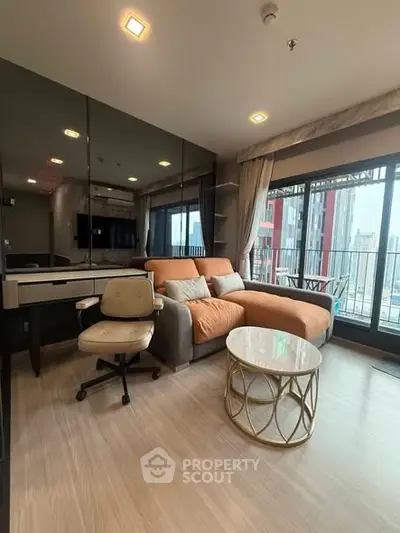 Modern living room with city view, featuring stylish furniture and large windows for natural light.