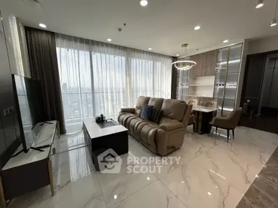 Luxurious modern living room with panoramic city view and elegant furnishings.