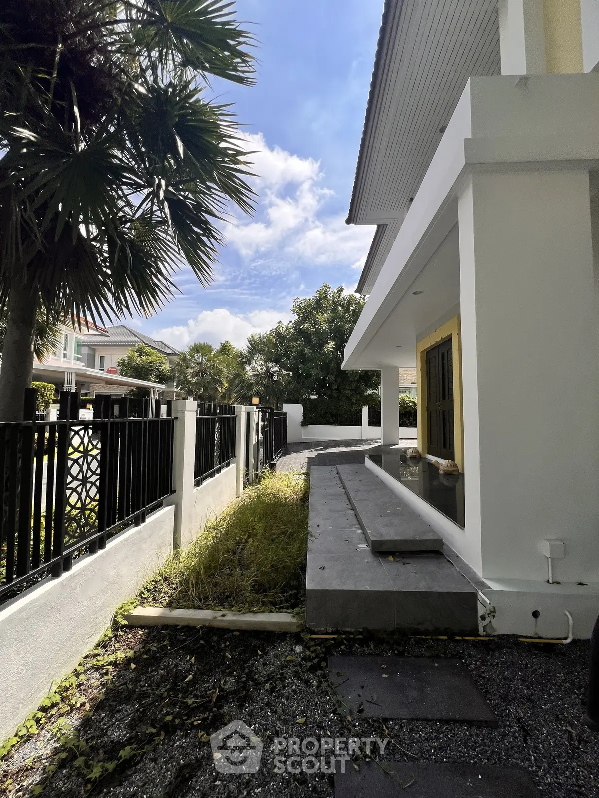 Charming suburban home with modern exterior and lush greenery, perfect for family living.