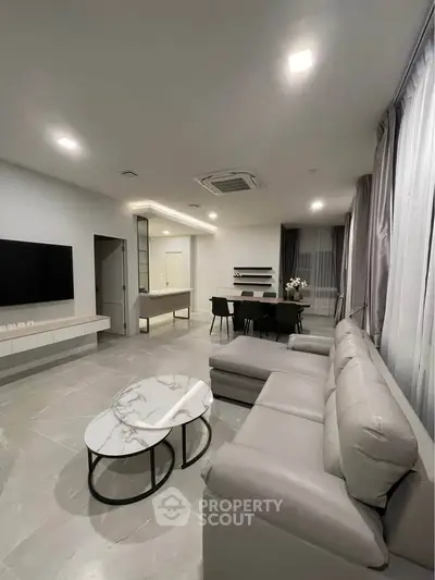 Modern living room with sleek furniture and elegant decor, perfect for stylish urban living.