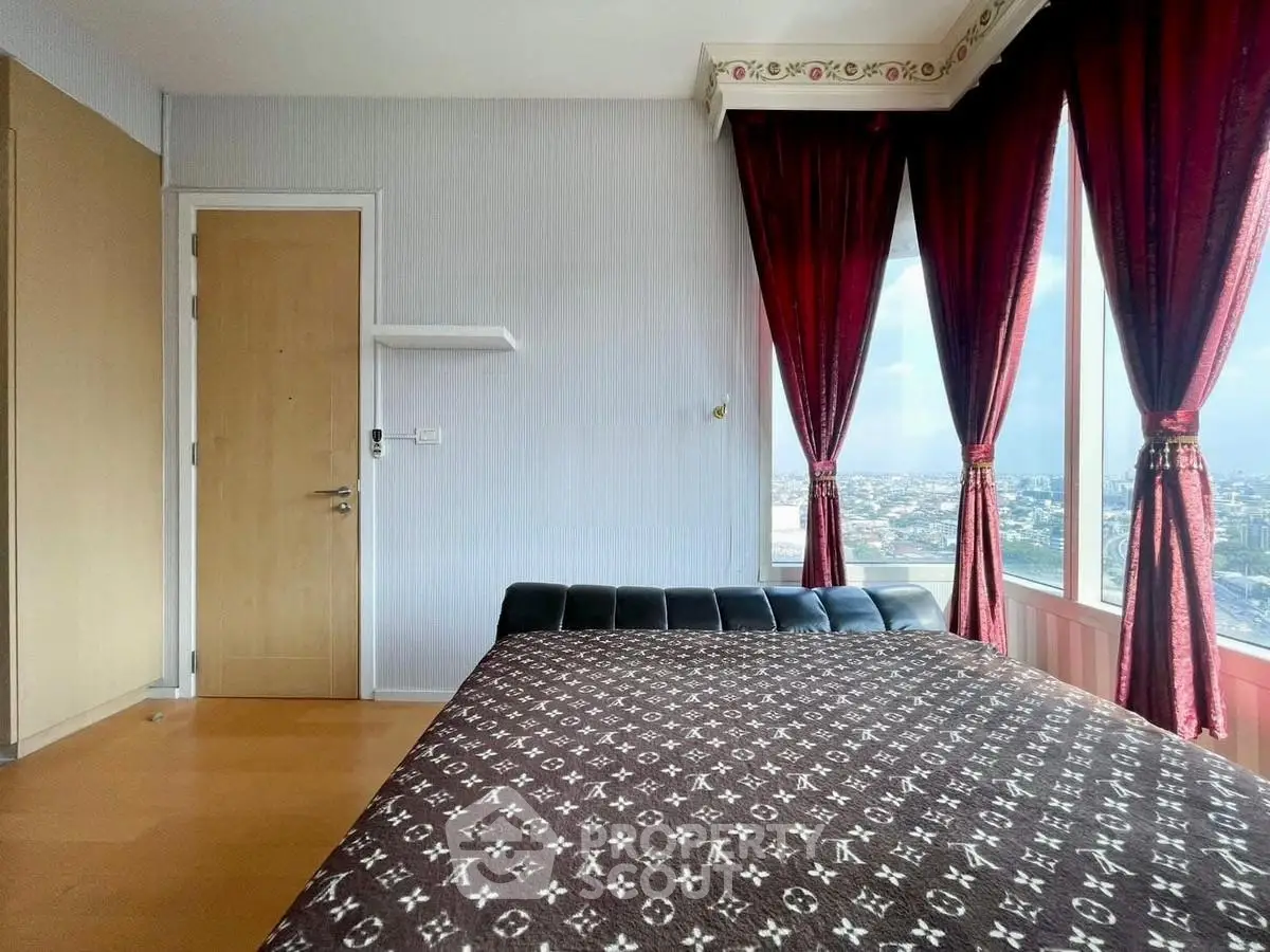 Stylish bedroom with panoramic city view and elegant red curtains