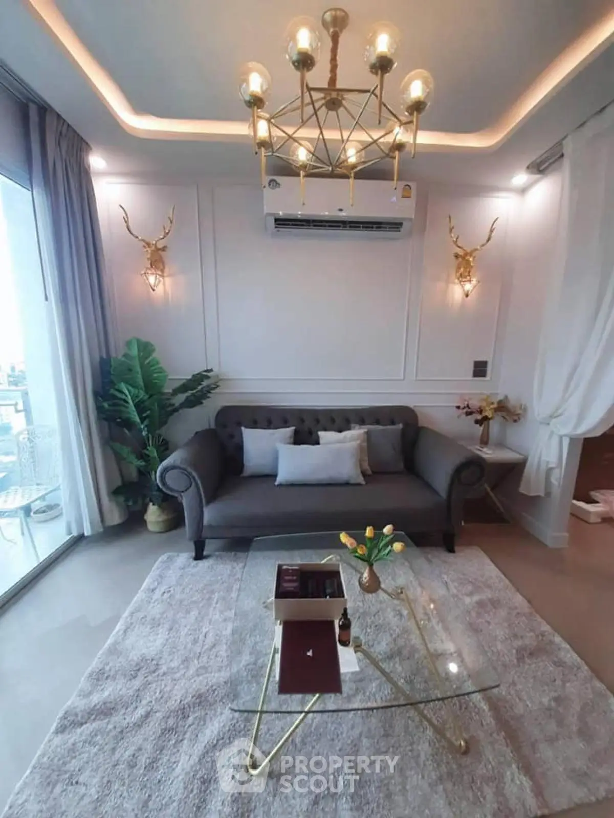 Luxurious living room with elegant decor and balcony view