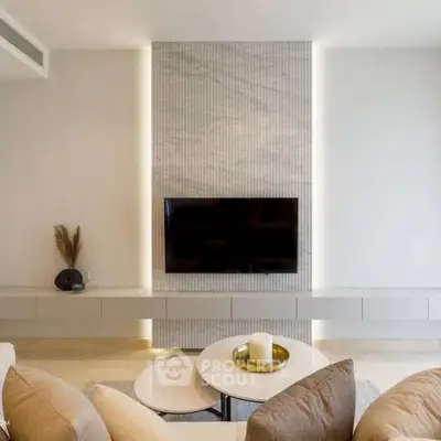 Modern living room with sleek TV setup and elegant decor