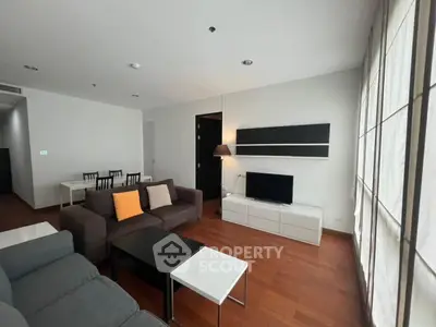 Spacious modern living room with sleek furniture and wooden flooring