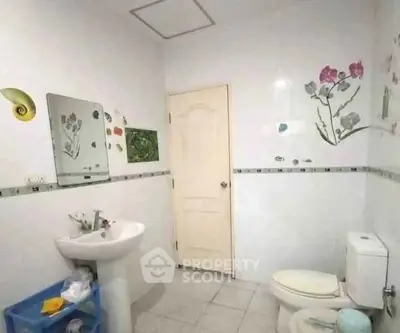 Charming bathroom with floral wall decor and modern fixtures