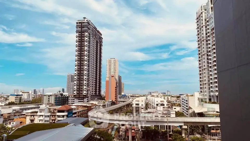 Stunning cityscape view with modern high-rise buildings and skytrain track.