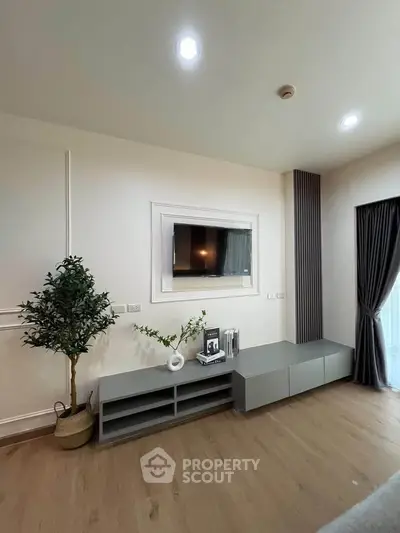 Modern living room with sleek TV setup and elegant decor