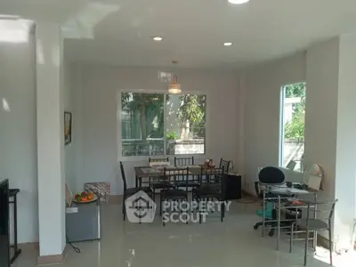 Spacious dining area with natural light and modern furniture
