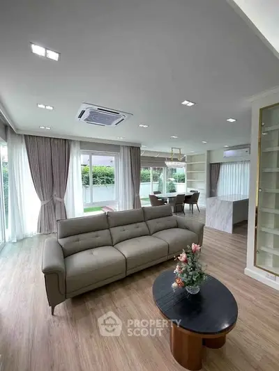 Spacious modern living room with elegant decor and garden view