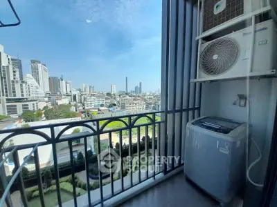 Stunning city view from a modern balcony with air conditioning unit.